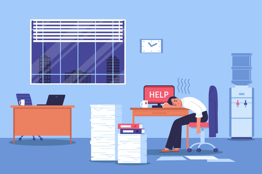 Signs of employee burnout in Kuwait workplace tired employee at desk